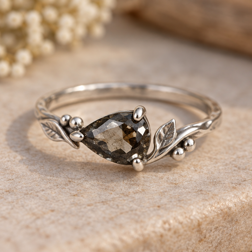 A women's ring made of silver, detailed and decorative, moderately ornate. use the stone above and make me a easily handmade ring no cast
using the attached image as a visual reference, create A women's ring made of silver, detailed and decorative, moderately ornate. use the stone above and make me a easily handmade ring no cast. photorealistic, just the design no text