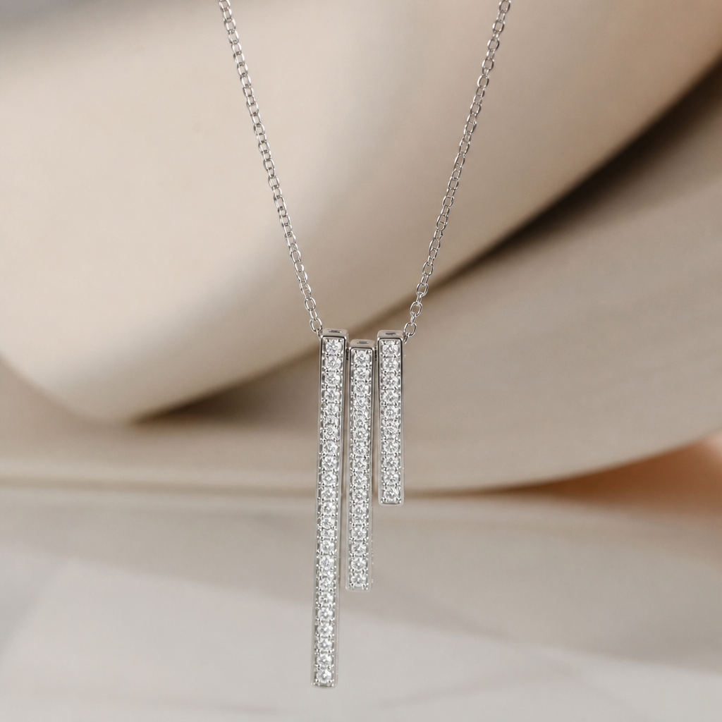 A minimalist women's pendant made of silver with diamond stones. collier avec des 3 rectangles minimlaiste de différente longueurs avec des touts petits diamands sur le dessus de chaque rectangle partout
photorealistic jewelry design, A minimalist women's pendant made of silver with diamond stones. collier avec des 3 rectangles minimlaiste de différente longueurs avec des touts petits diamands sur le dessus de chaque rectangle partout, minimalist style, just the design no text