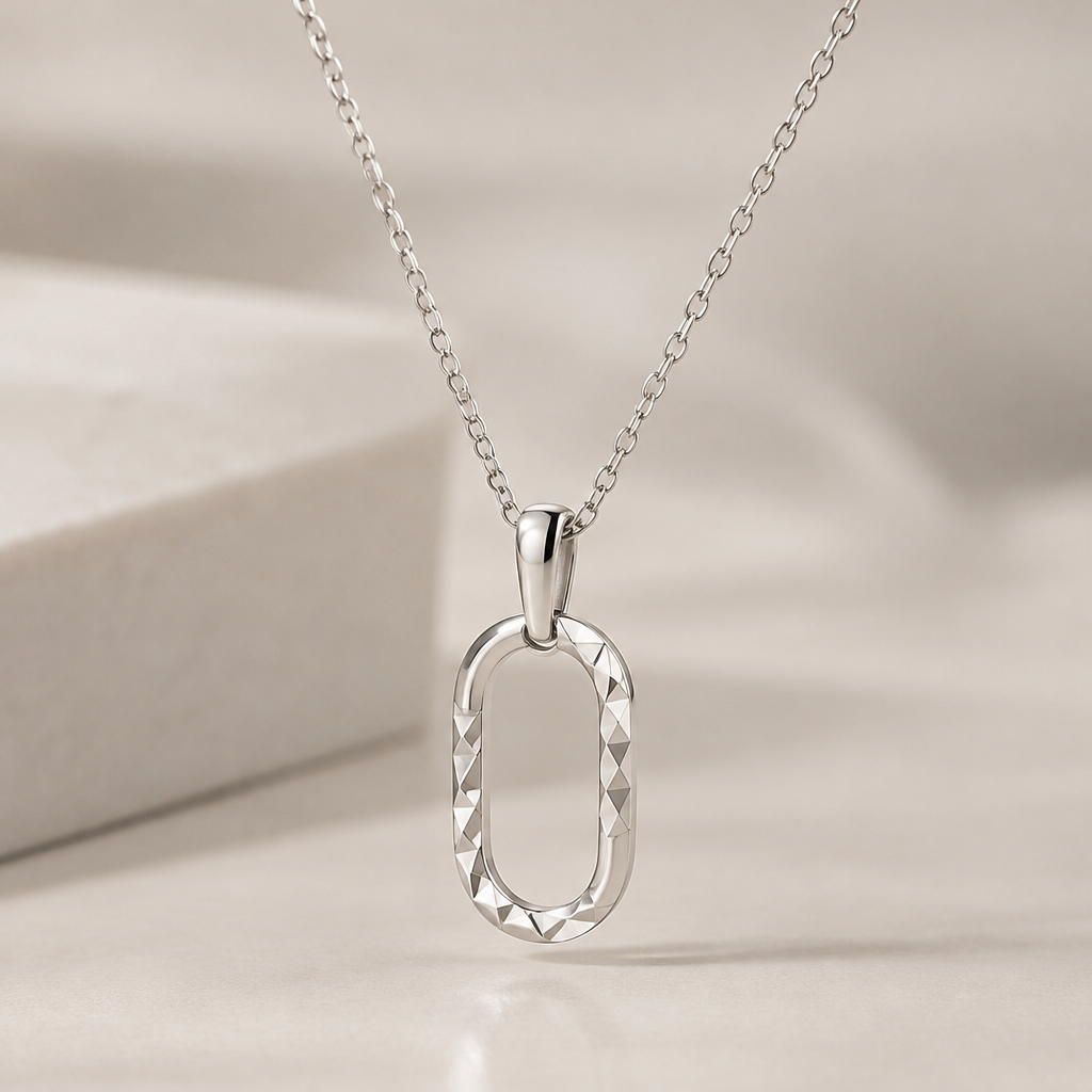 A women's pendant made of silver suitable for gift, minimalist, simple and delicate, clean lines. silver diamond cut pendant mob one chain
like o block
photorealistic jewelry design, A women's pendant made of silver suitable for gift, minimalist, simple and delicate, clean lines. silver diamond cut pendant mob one chain
like o block, modern style, just the design no text