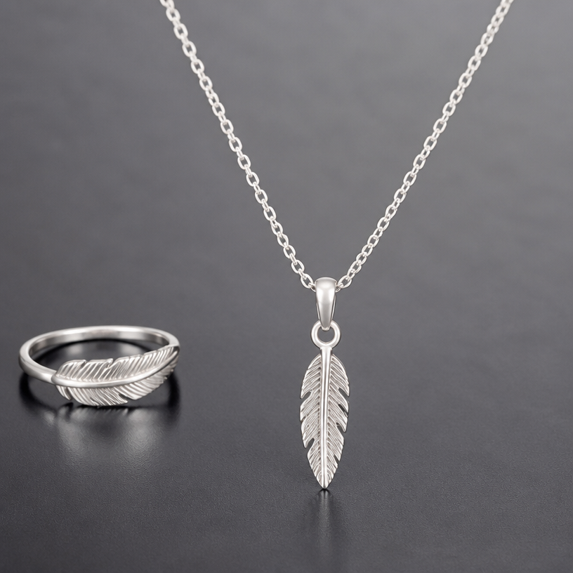 A women's ring made of silver suitable for daily wear. feather necklace
using the attached image as a visual reference, create A women's ring made of silver suitable for daily wear. feather necklace. photorealistic, just the design no text
