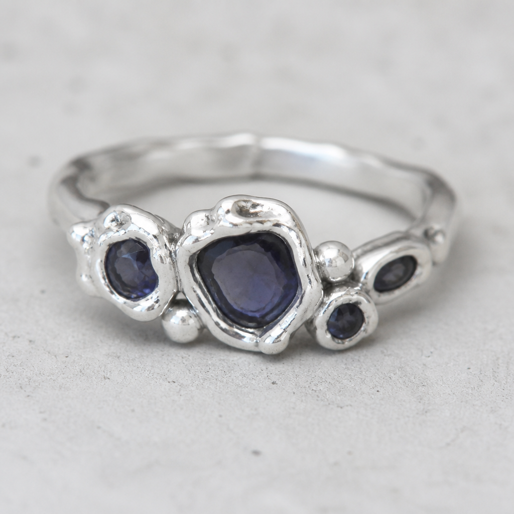 A bohemian women's ring made of silver with sapphire stones suitable for daily wear. 從照片的彩寶石,隨意形 地用銀黏土造成戒指. 適合年輕少女
photorealistic jewelry design, A bohemian women's ring made of silver with sapphire stones suitable for daily wear. 從照片的彩寶石,隨意形 地用銀黏土造成戒指. 適合年輕少女, bohemian style, just the design no text