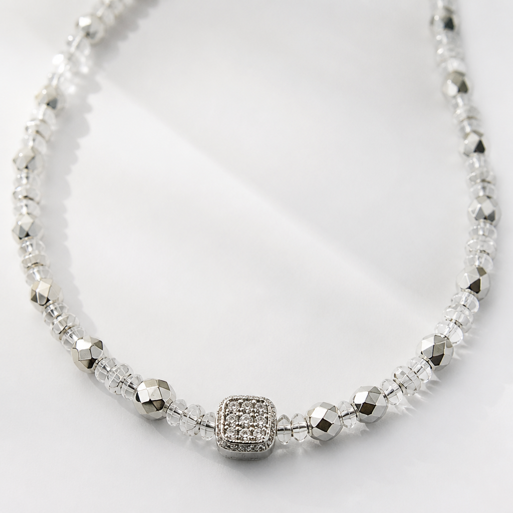 A women's necklace. из граненных серебряных бусин, квадратная вставка со стразами, бисер прозрачный
photorealistic jewelry design, A women's necklace. из граненных серебряных бусин, квадратная вставка со стразами, бисер прозрачный, modern style, just the design no text