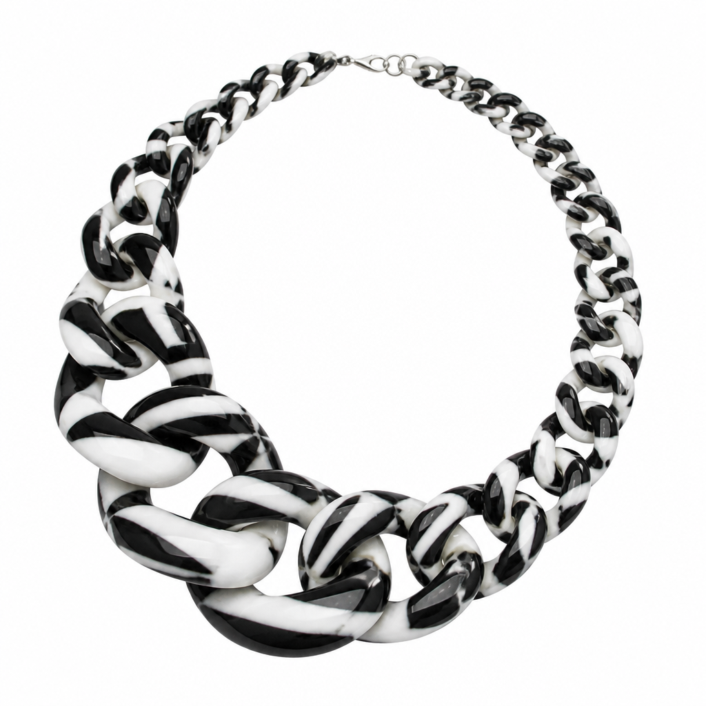 A women's necklace. create a chunky Cuban links style plastic necklace that is graduated and exaggerated in the first three links. make it the color of a zebra
photorealistic jewelry design, A women's necklace. create a chunky Cuban links style plastic necklace that is graduated and exaggerated in the first three links. make it the color of a zebra, modern style, just the design no text