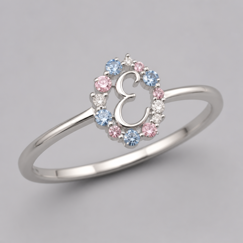 A minimalist women's ring, minimalist, simple and delicate, clean lines. um anel de 15 anos com inicial E com pedrinhas azul e pedrinhas rosa em volta
using the attached image as a visual reference, create A minimalist women's ring, minimalist, simple and delicate, clean lines. um anel de 15 anos com inicial E com pedrinhas azul e pedrinhas rosa em volta. photorealistic, just the design no text