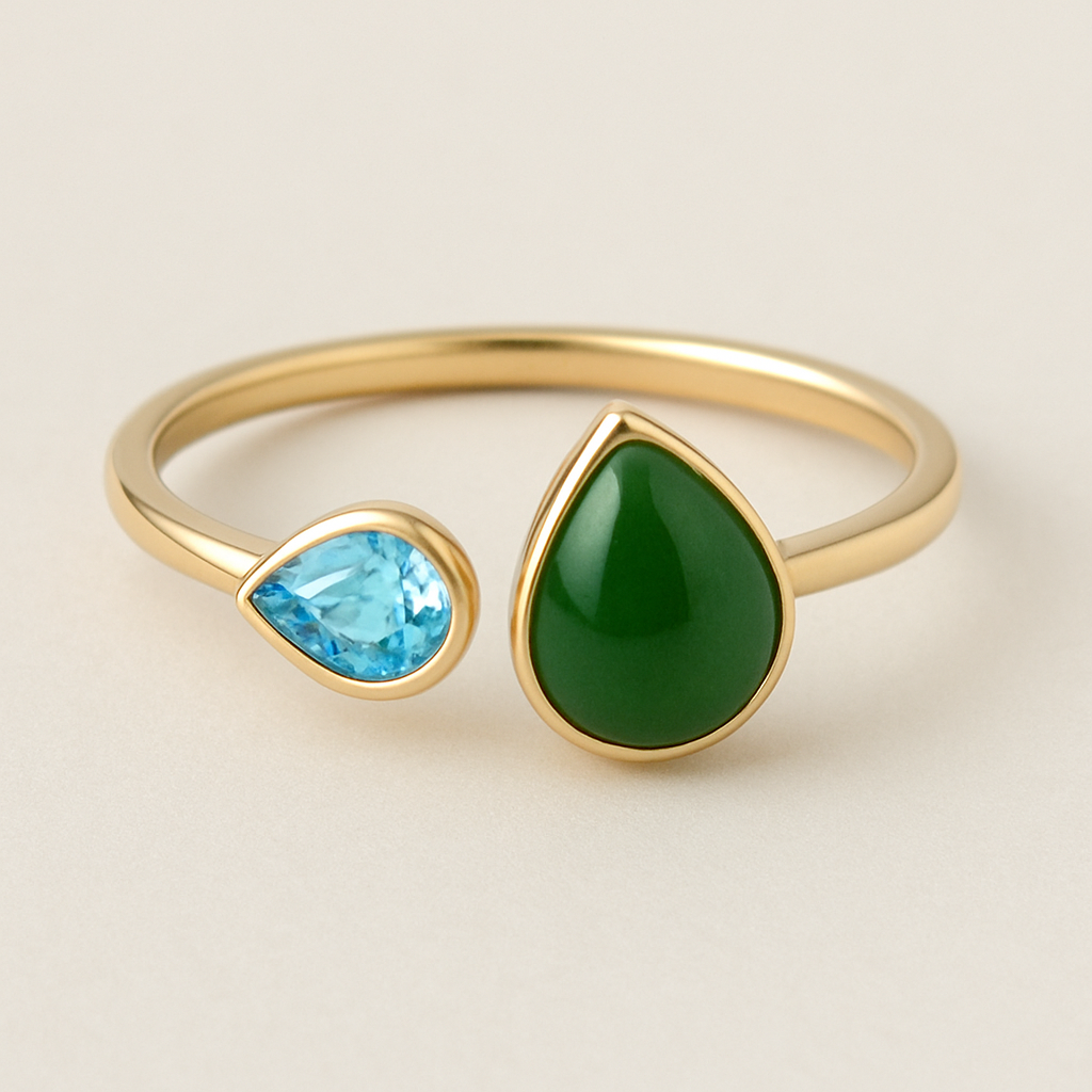 Toi et Moi Ring with a small pear shaped blue topaz and a slightly larger pear shaped nephrite jade stone