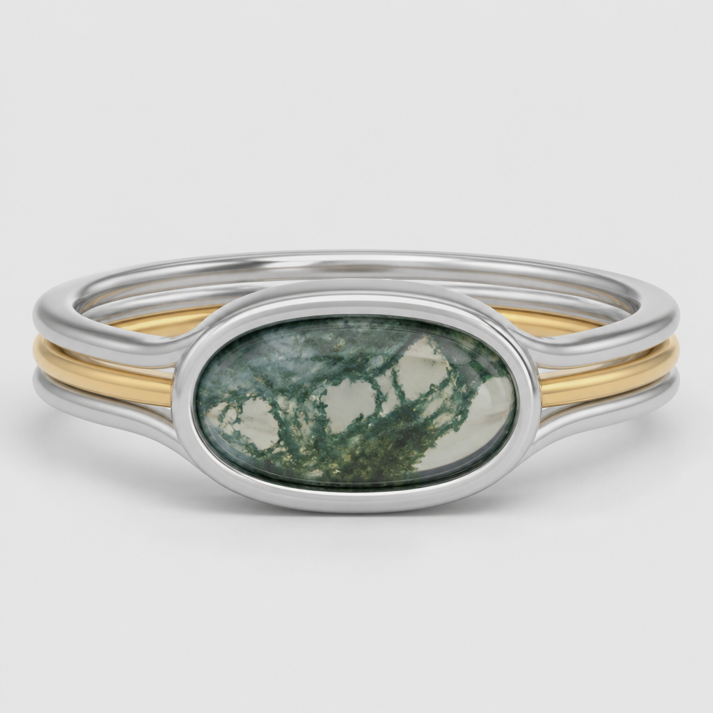 12mm x 4mm moss agate solitaire, east -west, full bezel, white gold setting with an open-basket under gallery. Band is a polished, three-stack with the outer bands in white gold and the inner band in yellow gold. Blend the supporting struts of the white gold bezel directly down into the outer 0.8mm white metal bands, allowing the center yellow gold stripe to visually pass directly "through" the center axis of the ring.