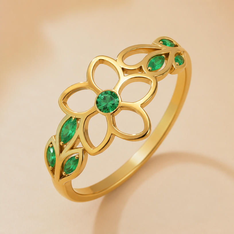 A nature women's ring made of gold with emerald stones