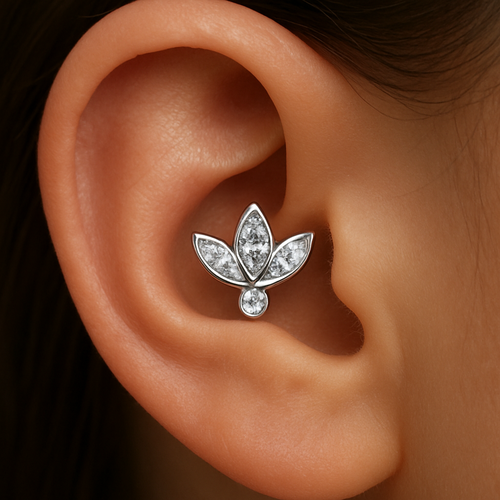 it is 14K white gold piercing jewelry with brilliants. the placement of piercing - helix (ear cartilage). the shape of the jewelry is lotus with 3 leaves (marquises) with small tiny round diamond below.