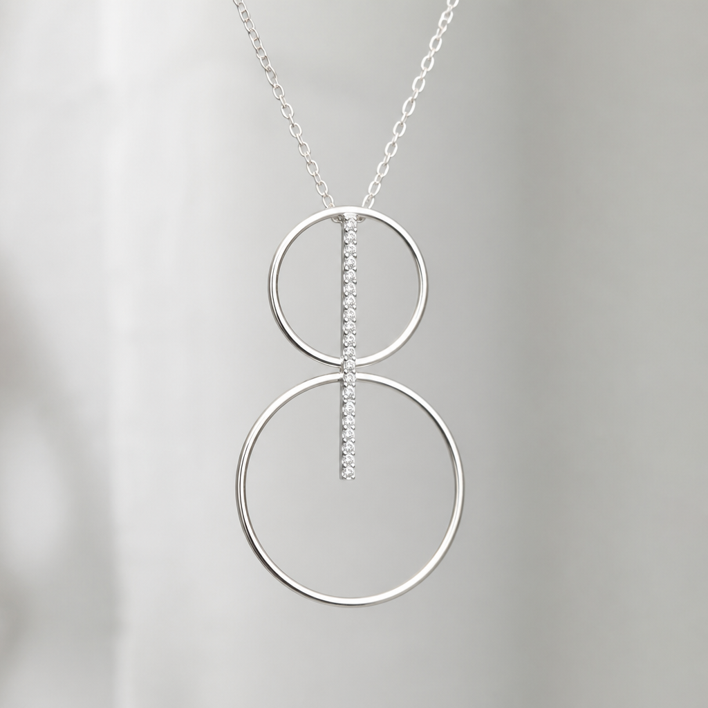 A women's pendant made of silver. collier avec 2 cercles fin, sans diamand, cercle du dessus plus petit, relié par une ligne de diamands qui est dans les cercles, cercles superposé haut en bas
photorealistic jewelry design, A women's pendant made of silver. collier avec 2 cercles fin, sans diamand, cercle du dessus plus petit, relié par une ligne de diamands qui est dans les cercles, cercles superposé haut en bas, modern style, just the design no text