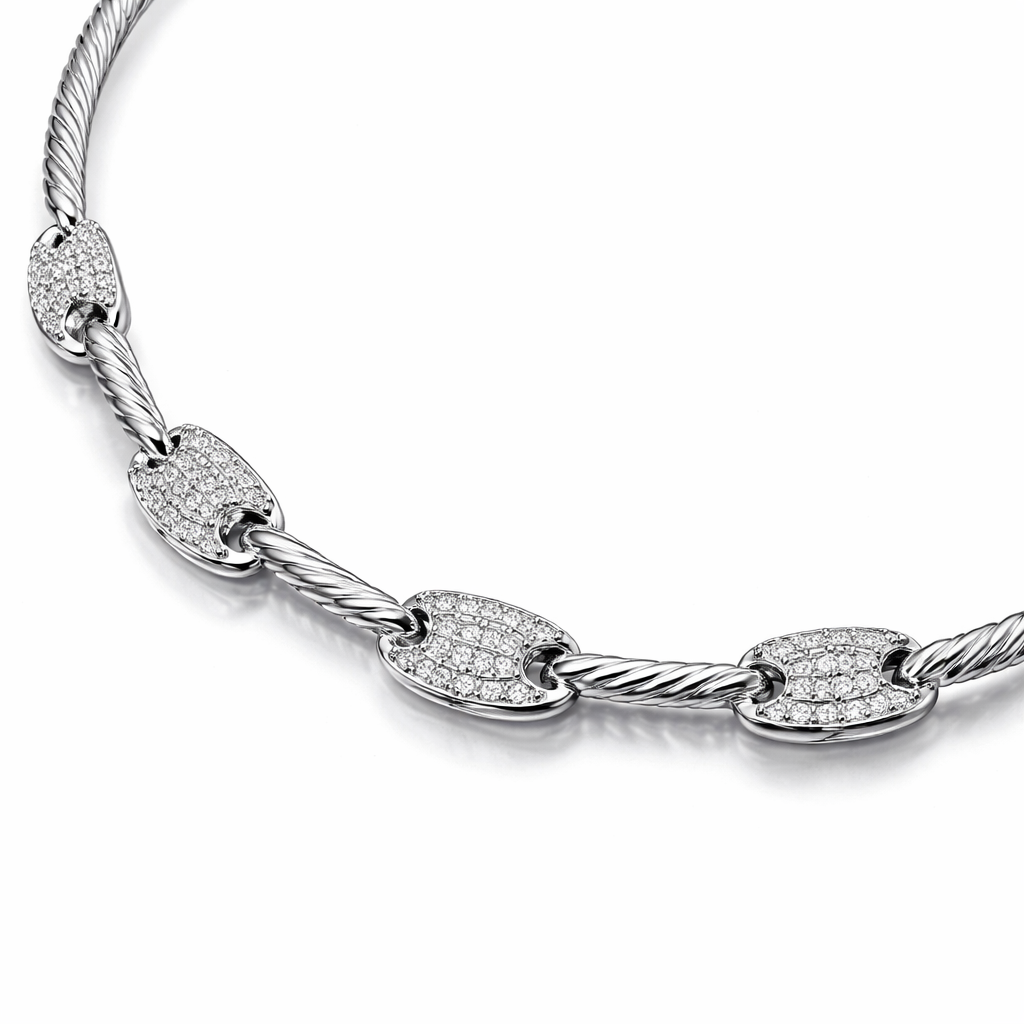 A flexible necklace which is not rigid and inspired by a twisted round wire and it has links that connected the meduim pieces with eachothe and it has diamondr