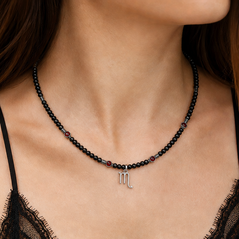 change the pendant, should be one without a background, so that it looks like the initial of the zodiac sign of Scorpio, and let the main base of this necklace be black tourmaline beads, and replace the golden-colored inclusions with beads of different gemstones (maybe hematite)