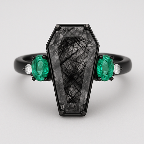 Coffin cut Black rutilated quartz with 1 emerald on each side and 3 moissanite on each side accent stones in a cluster on a black band