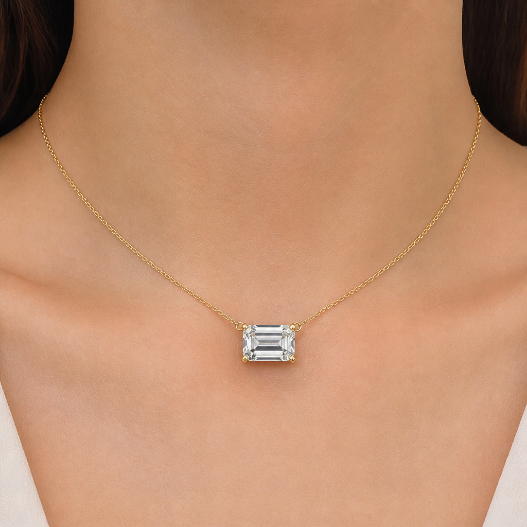 10ct emerald cut diamond pendant that can be placed on different chains. It has a small loop to thread chains through. The diamond is east west. Can show it on a 14inch necklace. All of the metal is yellow gold. Prongs not bezel
photorealistic jewelry design, 10ct emerald cut diamond pendant that can be placed on different chains. It has a small loop to thread chains through. The diamond is east west. Can show it on a 14inch necklace. All of the metal is yellow gold. Prongs not bezel , minimalist style, just the design no text