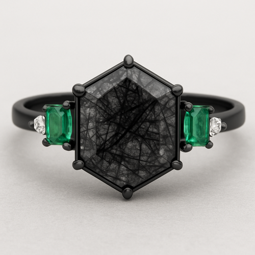 Skinny medium length Hexagon cut Black rutilated quartz with 1 emerald on each side and 3 moissanite on each side accent stones in a cluster on a black band