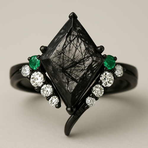 Kite cut Black rutilated quartz with 1 emerald on each side and 3 moissanite on each side accent stones in a cluster on a black band, second band black with moissanite stones that curves around the main stone 
