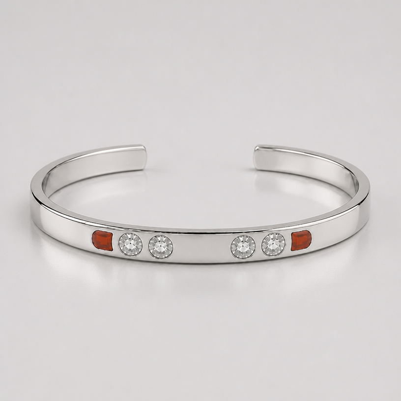 A women's bracelet made of silver. the red stones are engraving with same color enamel
using the attached image as a visual reference, create A women's bracelet made of silver. the red stones are engraving with same color enamel. photorealistic, just the design no text