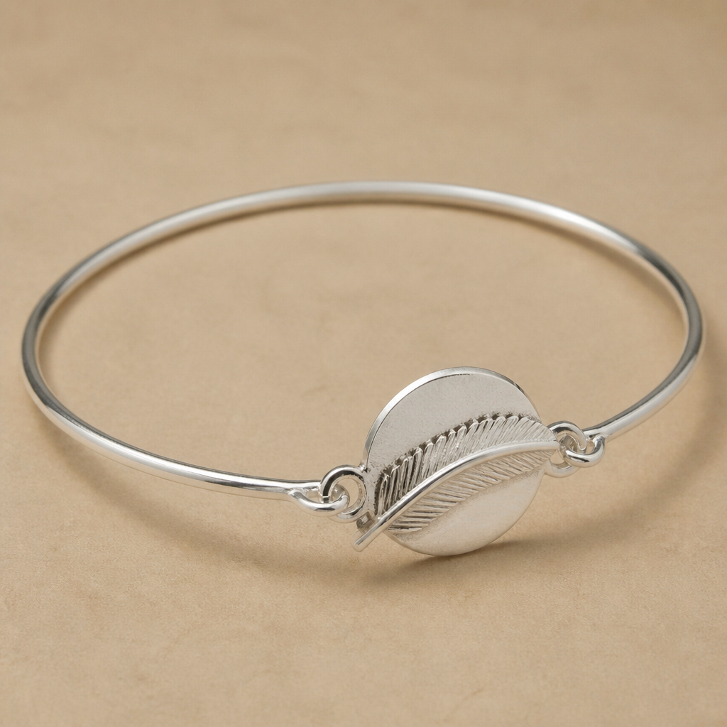 A bangle women's ring made of silver suitable for daily wear. a bangel with Fletcher shape which is a part of it made by a flat silver round and a cord is on the flat which is a Fletcher shape come out of the flat and again round the wrist
photorealistic jewelry design, A bangle women's ring made of silver suitable for daily wear. a bangel with Fletcher shape which is a part of it made by a flat silver round and a cord is on the flat which is a Fletcher shape come out of the flat and again round the wrist, bangle style, just the design no text