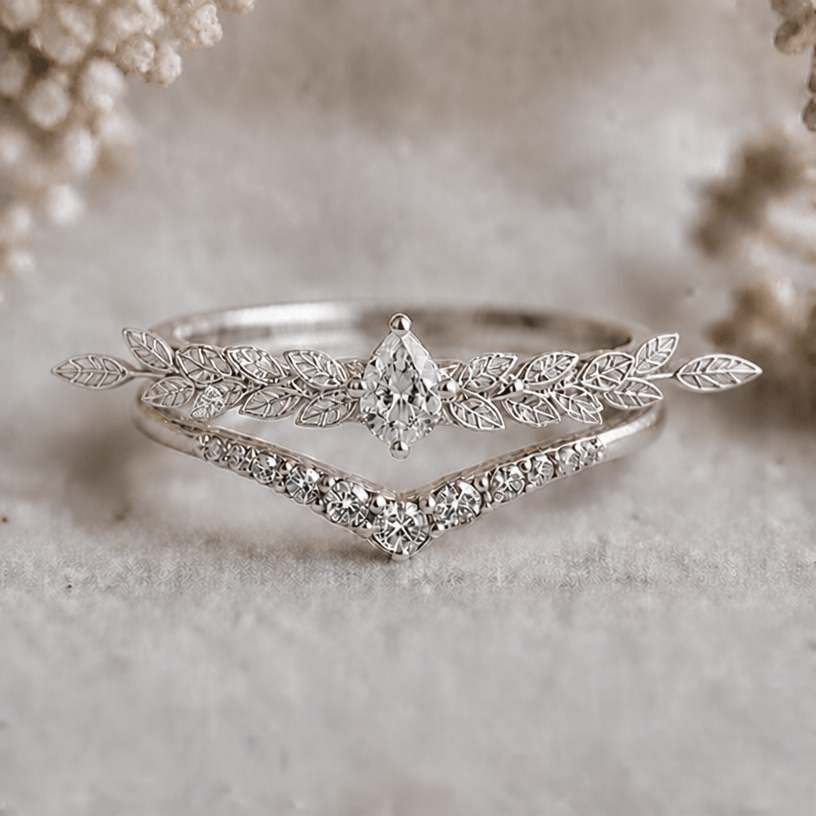 Let the leaves of the upper ring bleed out towards the sides and add small delicate rhinestones in between
edit the attached jewelry design with these instructions: Let the leaves of the upper ring bleed out towards the sides and add small delicate rhinestones in between. keep it photorealistic, just the design no text