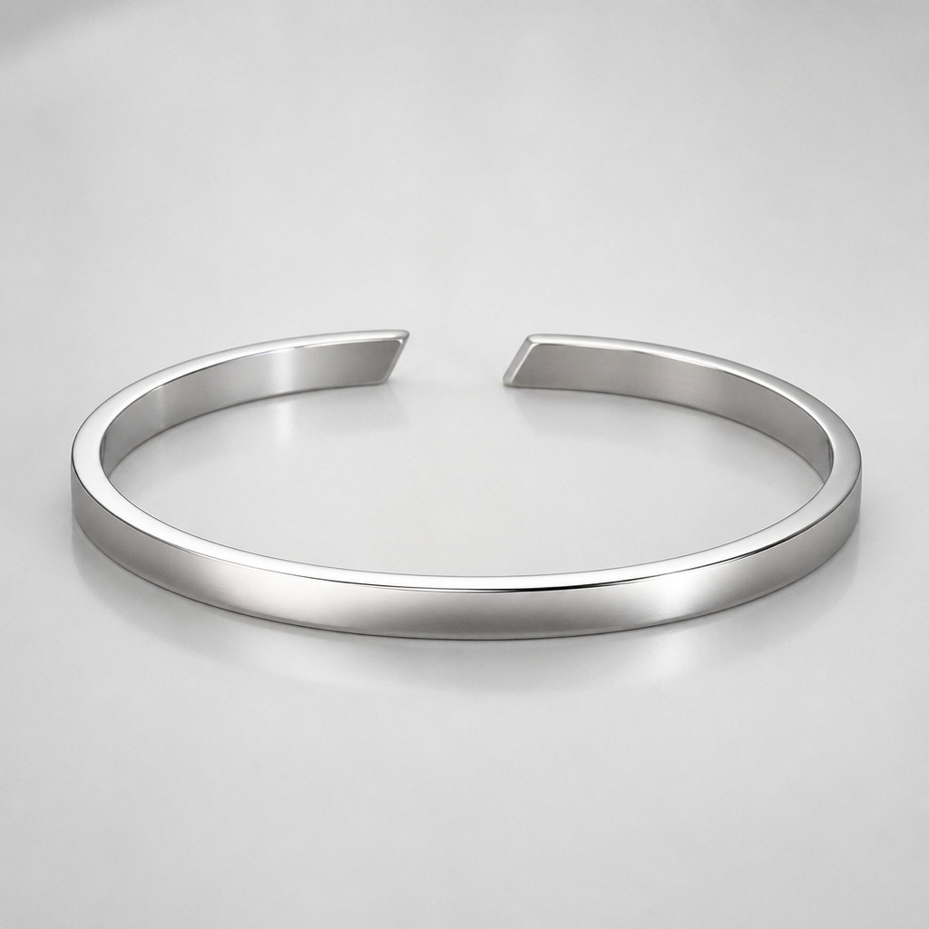 A men's bracelet made of silver. 2mm*4.5mm cuff that has the gap in the front and the gap line are italic
photorealistic jewelry design, A men's bracelet made of silver. 2mm*4.5mm cuff that has the gap in the front and the gap line are italic, modern style, just the design no text