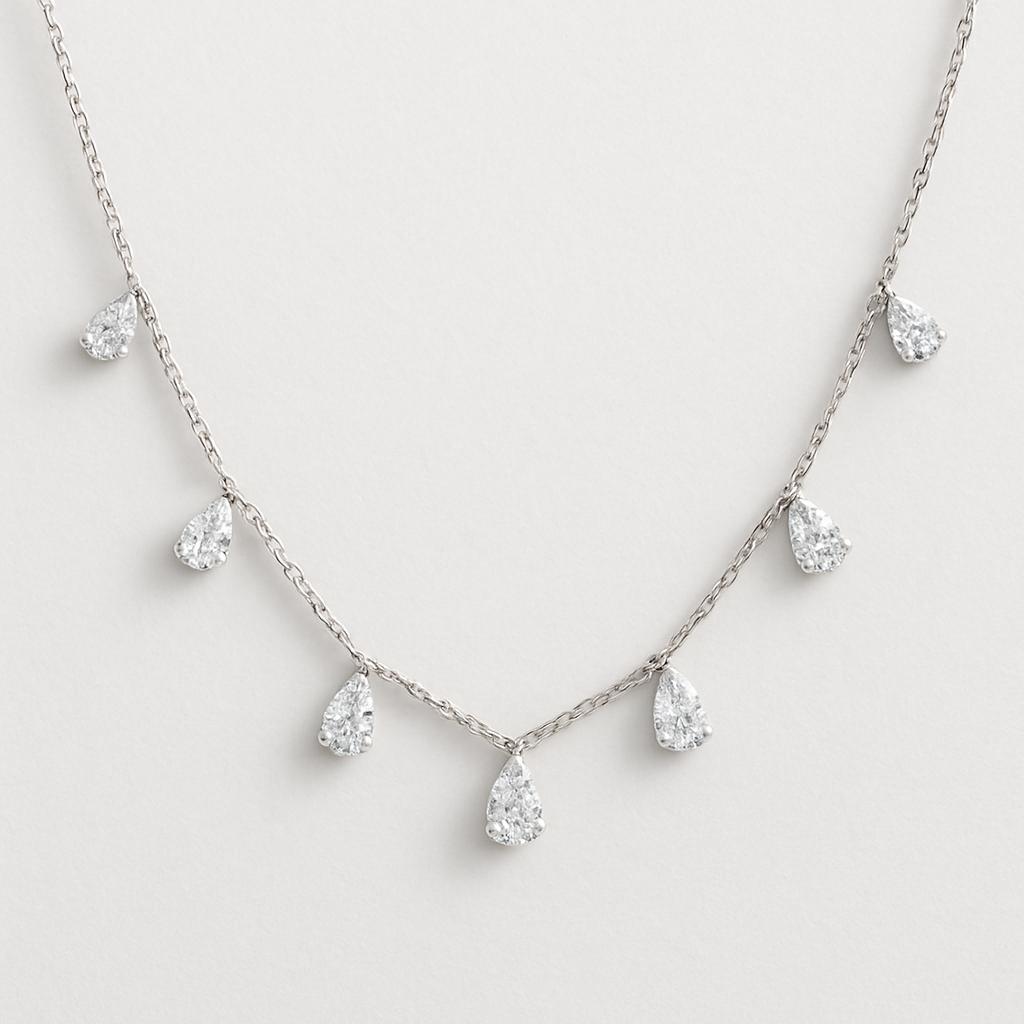 Pear shape pears station necklace 7 diamonds small each diamonds .15 no bezel