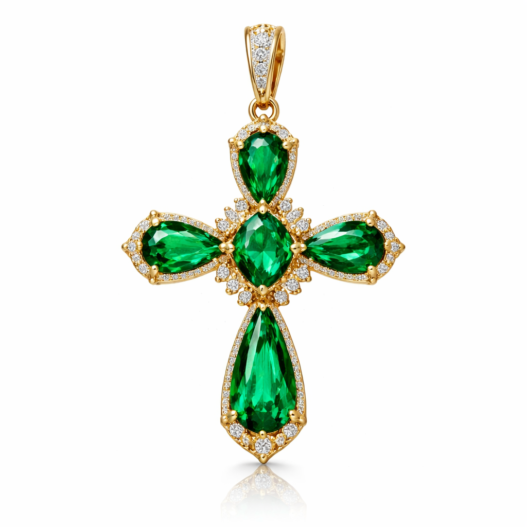 Pear cut Emerald Cross in yellow gold. Classic and stunning. A few accent diamonds.