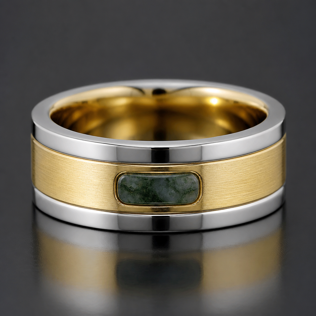 A three stack men’s wedding band with the two outer bands, white gold, 2mm wide each, the inner band in yellow gold, 5mm wide, with a 3mm by 1.5mm, horizontally-set inlay of moss agate on top