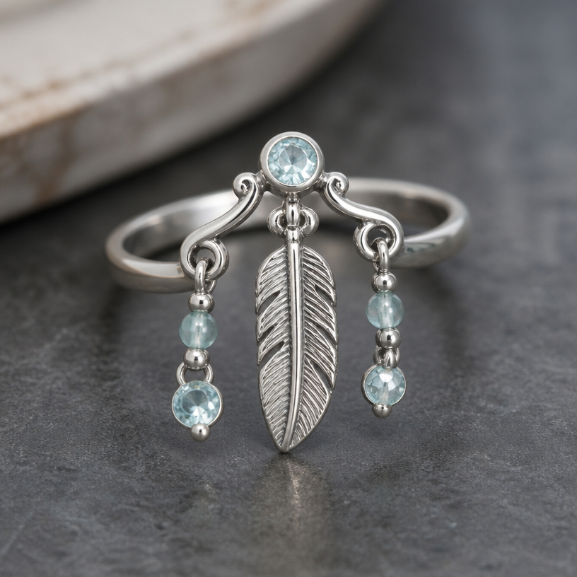 A women's ring made of silver with aquamarine stones suitable for daily wear. feather pendant and chain
using the attached image as a visual reference, create A women's ring made of silver with aquamarine stones suitable for daily wear. feather pendant and chain. photorealistic, just the design no text