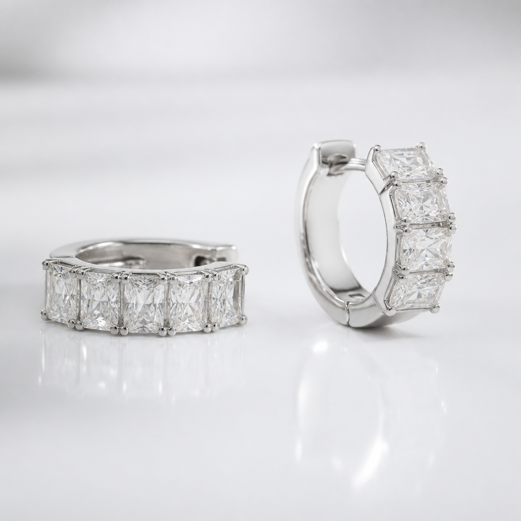 I want diamond huggies which have 5 radiant cut diamonds, placed east west, with a total carat weight of 2.00 carats for a pair. It should have white rhodium.
photorealistic jewelry design, I want diamond huggies which have 5 radiant cut diamonds, placed east west, with a total carat weight of 2.00 carats for a pair. It should have white rhodium. , modern style, just the design no text