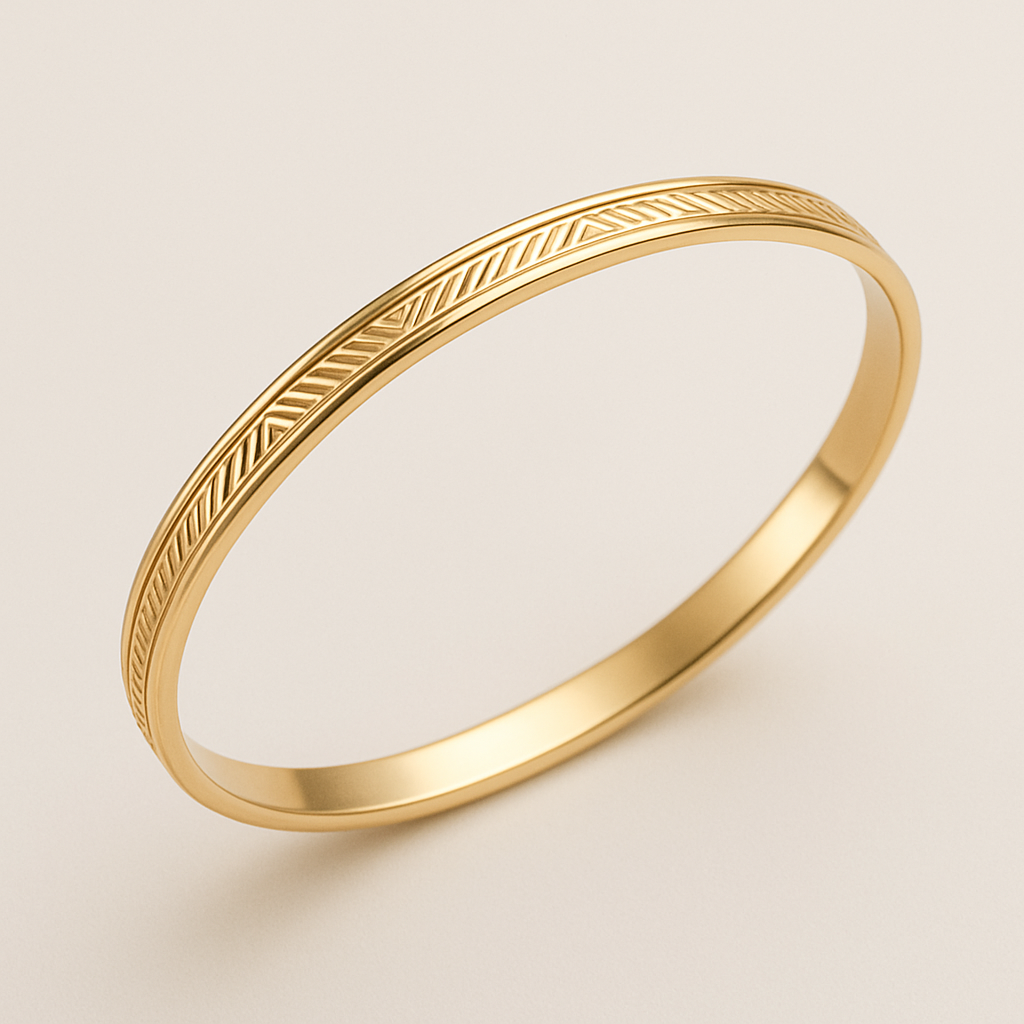 Create a 14k yellow gold bangle with sophisticated detailing