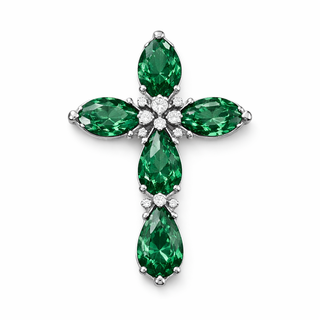 Pear cut emerald cross on 14k white gold with bale attached to the back and not shown. Few diamond accent stones. Classic, simple, and elegant