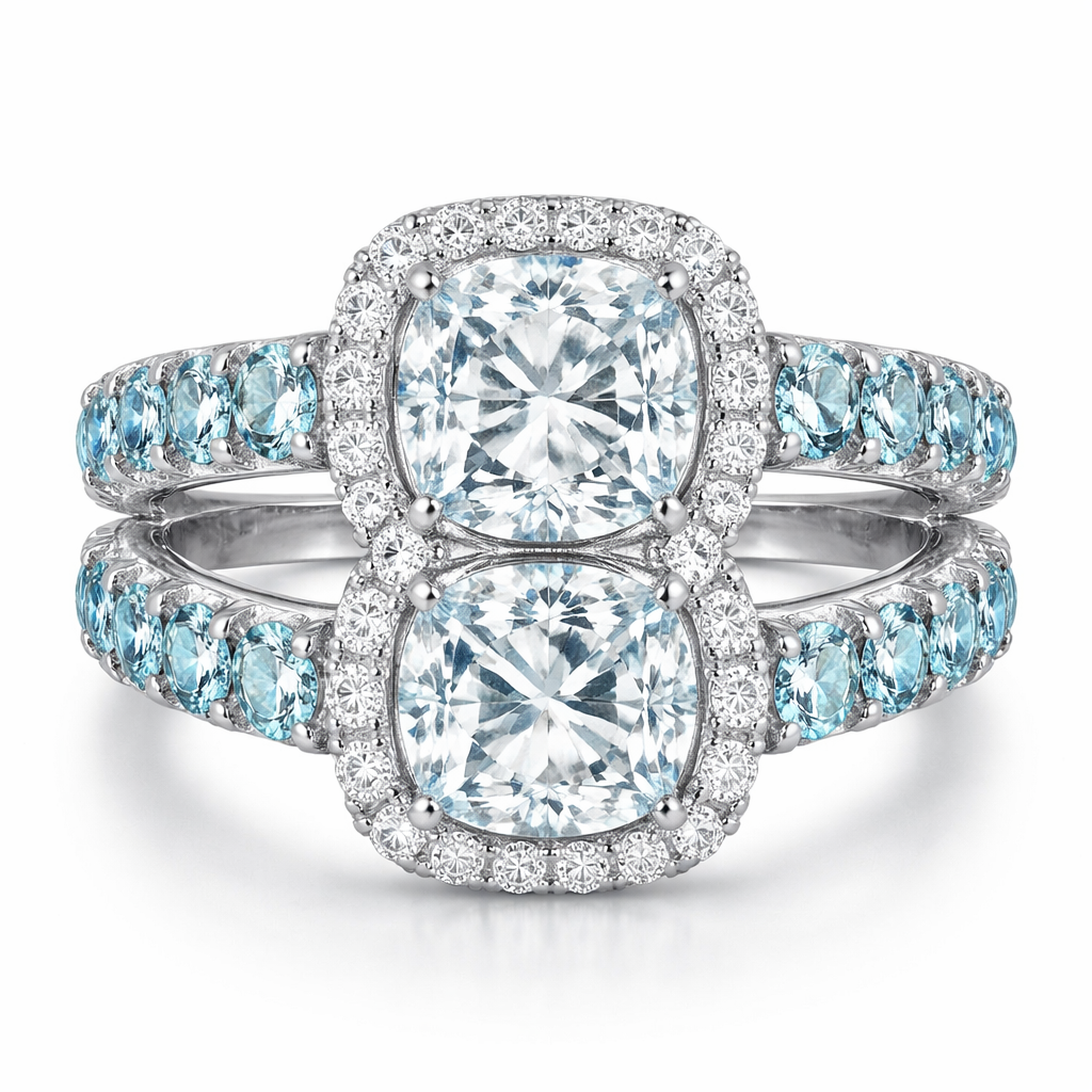 Combine 2 rings that are both a cushion cut diamond with halo and both have an aquamarine band, connect them with one on top of the other
