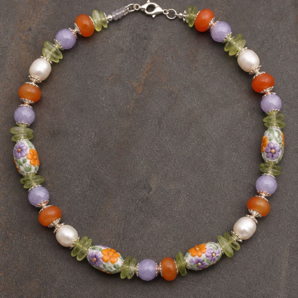 Lamp work beads with orange white purple flowers with green vines 14mm x 8mm, lavender faceted opaque crystals 7.5mm rounds, potato shaped white freshwater pearls 9mm, peridot chips 7.5mm, orange carnelian rondels 9.5mm x 5mm necklace
photorealistic jewelry design, Lamp work beads with orange white purple flowers with green vines 14mm x 8mm, lavender faceted opaque crystals 7.5mm rounds, potato shaped white freshwater pearls 9mm, peridot chips 7.5mm, orange carnelian rondels 9.5mm x 5mm necklace , nature_inspired style, just the design no text