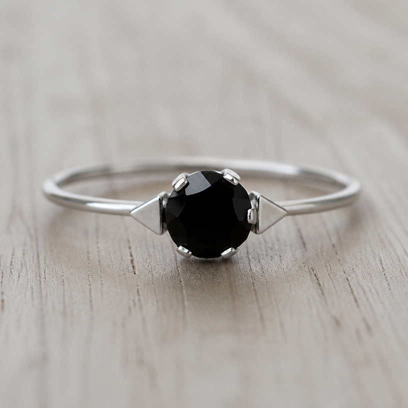 A women's ring made of silver, minimalist, simple and delicate, clean lines. take this black onyx and make some triangles outside the stone on either side out of silver
using the attached image as a visual reference, create A women's ring made of silver, minimalist, simple and delicate, clean lines. take this black onyx and make some triangles outside the stone on either side out of silver. photorealistic, just the design no text