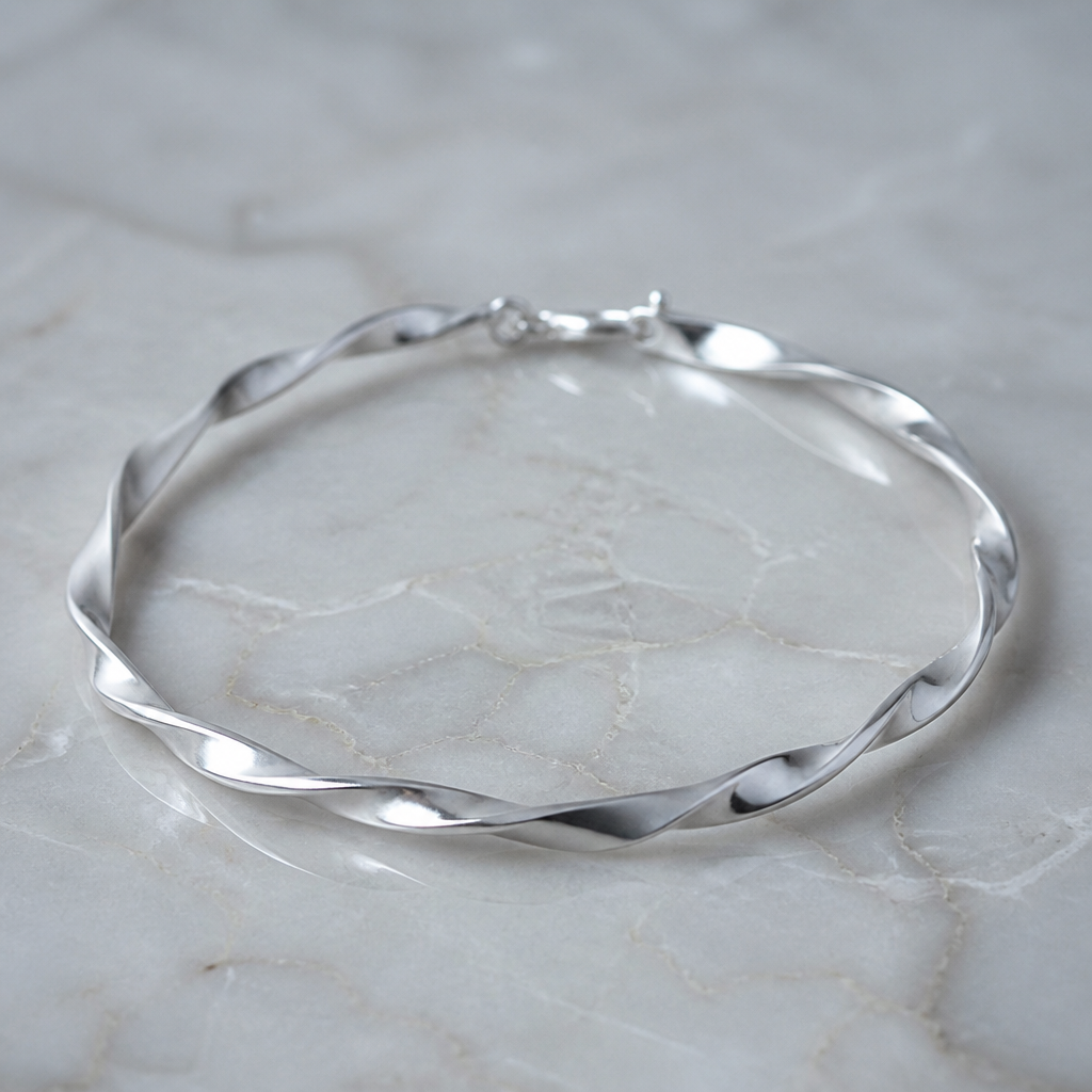 A women's bracelet made of silver, minimalist, simple and delicate, clean lines. a 3mm square twisted bracelet
photorealistic jewelry design, A women's bracelet made of silver, minimalist, simple and delicate, clean lines. a 3mm square twisted bracelet, modern style, just the design no text