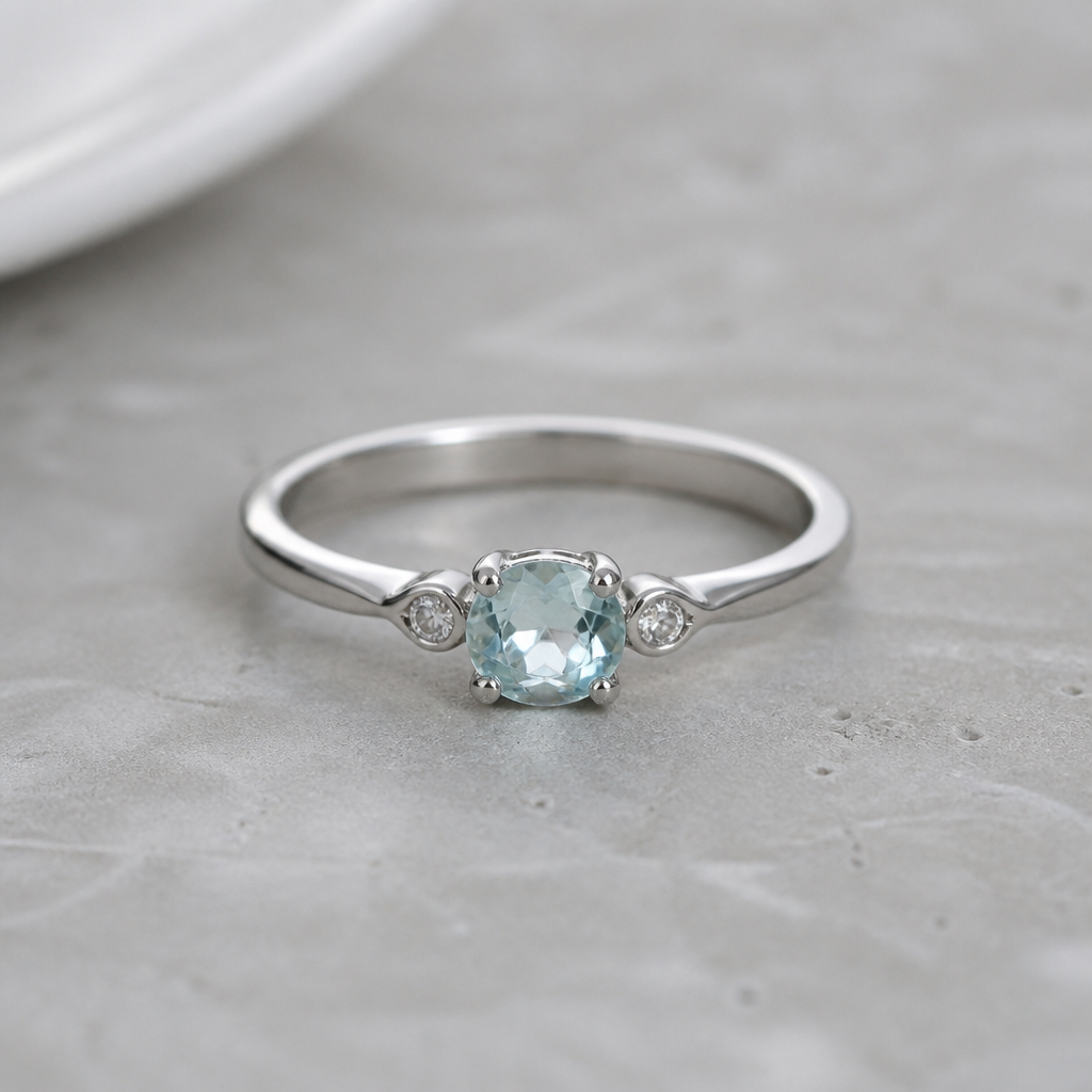 A minimalist women's ring made of silver with aquamarine stones suitable for daily wear
photorealistic jewelry design, A minimalist women's ring made of silver with aquamarine stones suitable for daily wear, minimalist style, just the design no text