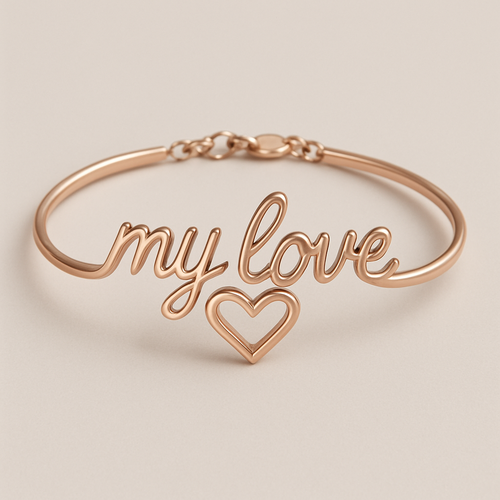 A rose gold bracelet that says “my love” in cursive with a heart shape under it 