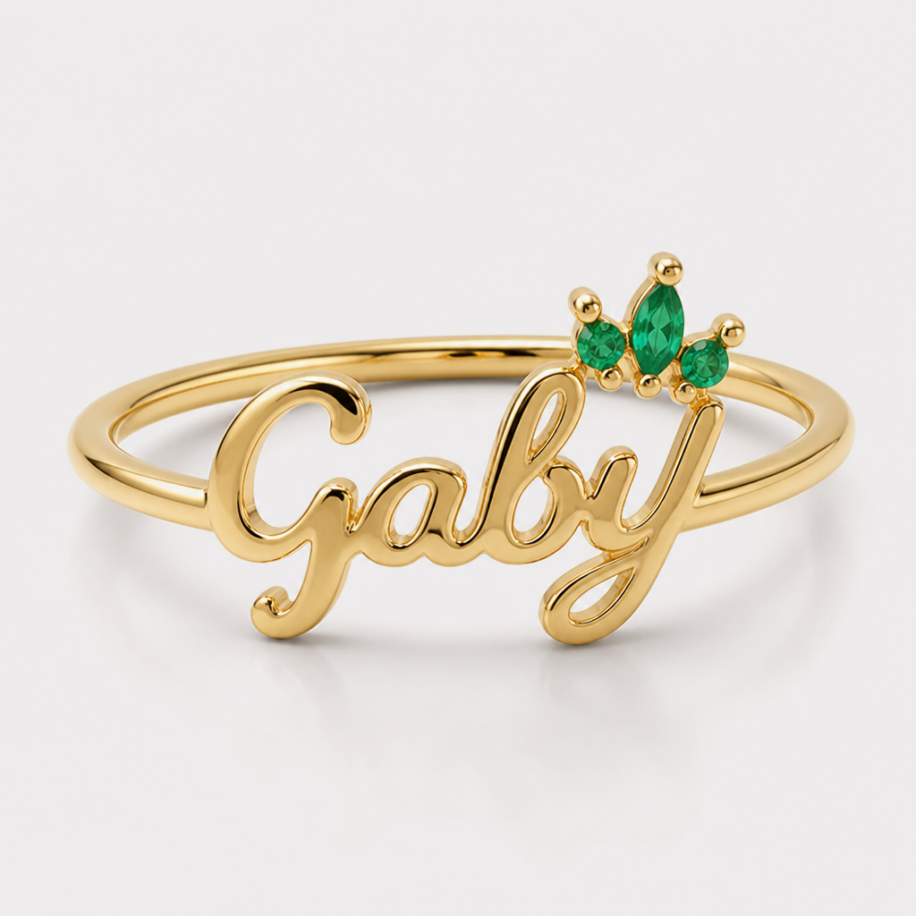 A women's ring. un delicado anillo con nombre Gaby y sobre la y una coroma que tenga esmeralda
photorealistic jewelry design, A women's ring. un delicado anillo con nombre Gaby y sobre la y una coroma que tenga esmeralda, modern style, just the design no text