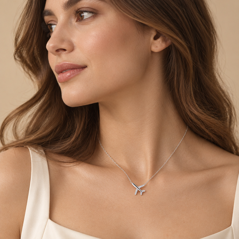 Jewelry photoshoot (worn)
Show the jewelry piece from the image worn by an elegant model in a professional editorial photograph, soft studio lighting. Reproduce the jewelry's exact design, metal, stones and details faithfully. Photorealistic, no text. Additional instructions: "Photorealistic, medium close-up shot of an elegant woman with her hair loose and flowing naturally over her shoulders, her head turned to look toward the left, showing half of her face in profile along with her neck and shoulders, in soft, diffused lighting. She is wearing a delicate, minuscule sterling silver necklace with the interlocked pavé diamond-encrusted heart and the polished silver heart exactly as shown in image_8.png. The pendant is resting naturally at the base of her neck. Her posture is graceful. Minimalist beige backdrop, shallow depth of field, focused sharply on the necklace and skin texture. 8k resolution, cinematic quality. Make sure the necklace chain stays as it is in the picture, meaning do not add any stones to it.
Jewelry scale note: the necklace and pendant must be small, delicate and realistically proportioned — not oversized or exaggerated, true to how fine jewelry actually looks in real life." Jewelry scale note: the necklace and pendant must be small, delicate and realistically proportioned — not oversized or exaggerated, true to how fine jewelry actually looks in real life..
