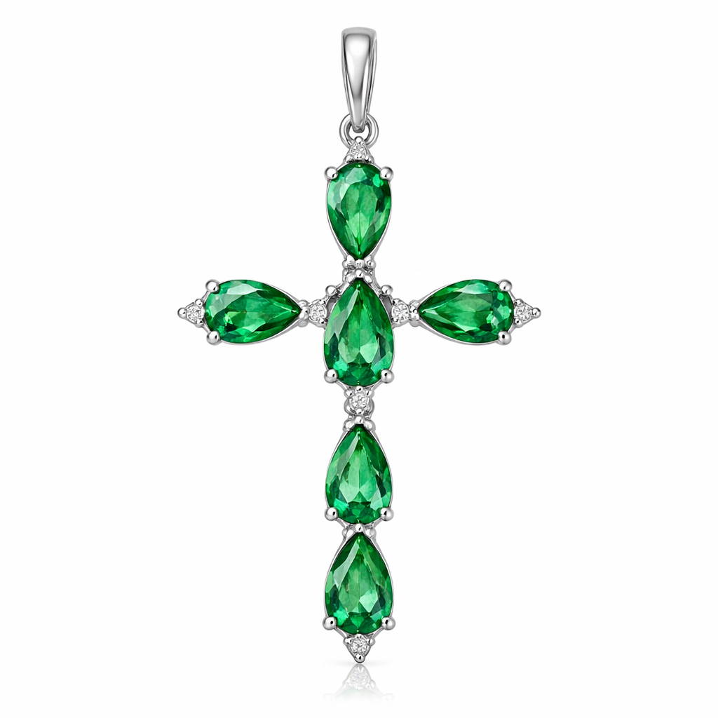 Simple and timeless pear cut emerald white gold cross with minimal diamond accents. Light metal work.