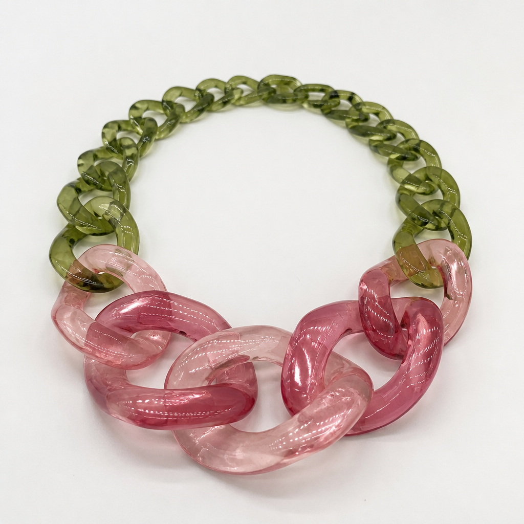 A women's necklace. create a chunky Cuban links style plastic necklace that is graduated and exaggerated in the first three links of translucent colors with the back part being green like a flower stem and the front part being a rose color
photorealistic jewelry design, A women's necklace. create a chunky Cuban links style plastic necklace that is graduated and exaggerated in the first three links of translucent colors with the back part being green like a flower stem and the front part being a rose color, modern style, just the design no text