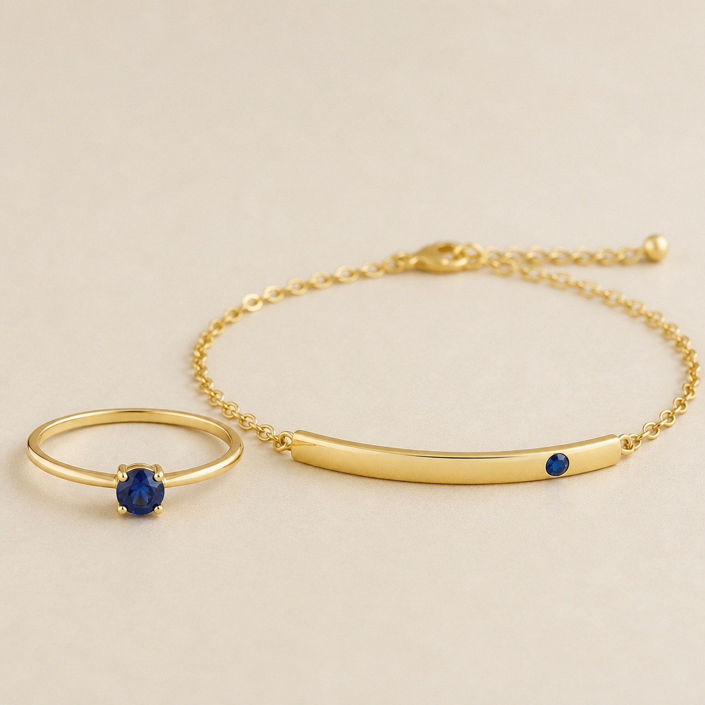 A minimalist women's ring made of gold with sapphire stones. a simple gold bracelet with the words Be Still and a saphire stone.
photorealistic jewelry design, A minimalist women's ring made of gold with sapphire stones. a simple gold bracelet with the words Be Still and a saphire stone., minimalist style, just the design no text