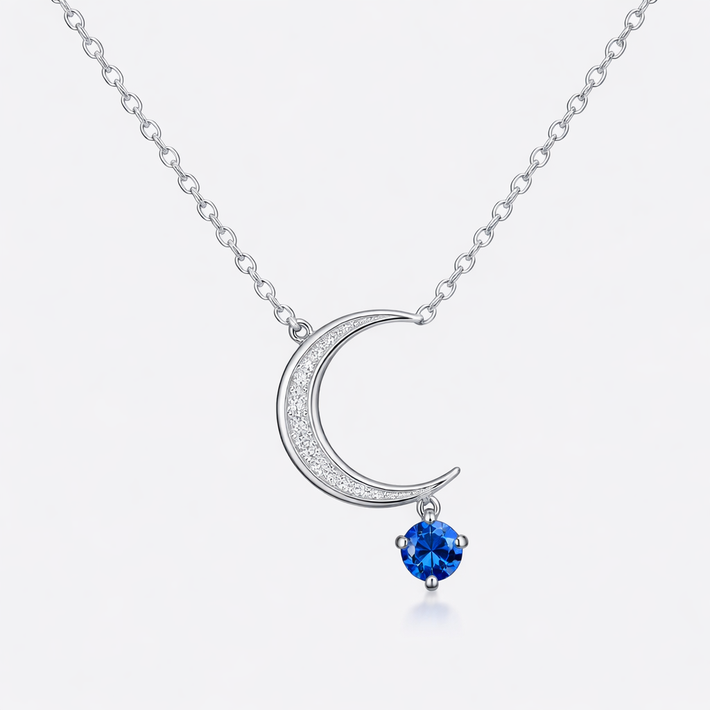 A minimalist women's necklace made of silver with diamond and sapphire stones suitable for daily wear. colar com lua e uma pedra na ponta dela
