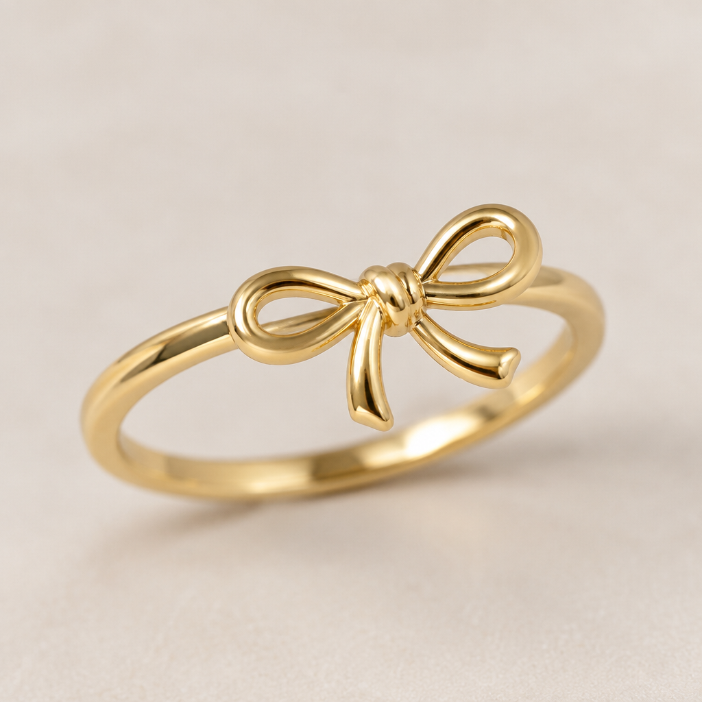 A minimalist women's ring made of gold suitable for gift. ring with the aesthetic ribbon design and the ribbon is tilting to right a bit.
the ring goes around the ribbon not under the ribbon.
the ribbon is tied like a single knot and the ribbon has two same size loops.
the ribbon is rounded design not flat and both of the ribbon tails is a little bit bendy.
photorealistic jewelry design, A minimalist women's ring made of gold suitable for gift. ring with the aesthetic ribbon design and the ribbon is tilting to right a bit.
the ring goes around the ribbon not under the ribbon.
the ribbon is tied like a single knot and the ribbon has two same size loops.
the ribbon is rounded design not flat and both of the ribbon tails is a little bit bendy., minimalist style, just the design no text