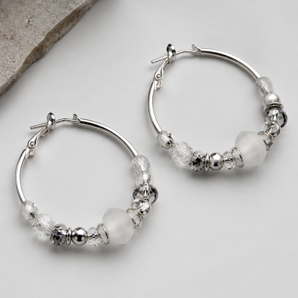 A modern women's earrings made of silver. hoop earrings with different types of beads and crystals
photorealistic jewelry design, A modern women's earrings made of silver. hoop earrings with different types of beads and crystals, modern style, just the design no text