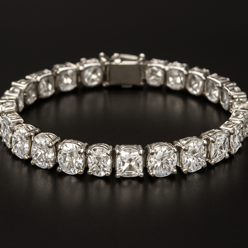 Diamond tennis bracelet set with oval, round and square shaped diamonds All the same size just a different shape Dense as silver One carat each diamond