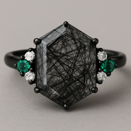 Hexagon cut Black rutilated quartz with 1 emerald on each side and 2 moissanite on each side accent stones in a cluster on a black band