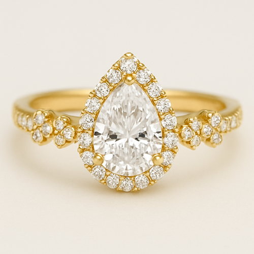 Pear shaped, white diamond , band width 3 mm , gold ring, halo around the diamond and small diamond on the sides of the ring. Diamonds are set in little four-stone flower designs around the band