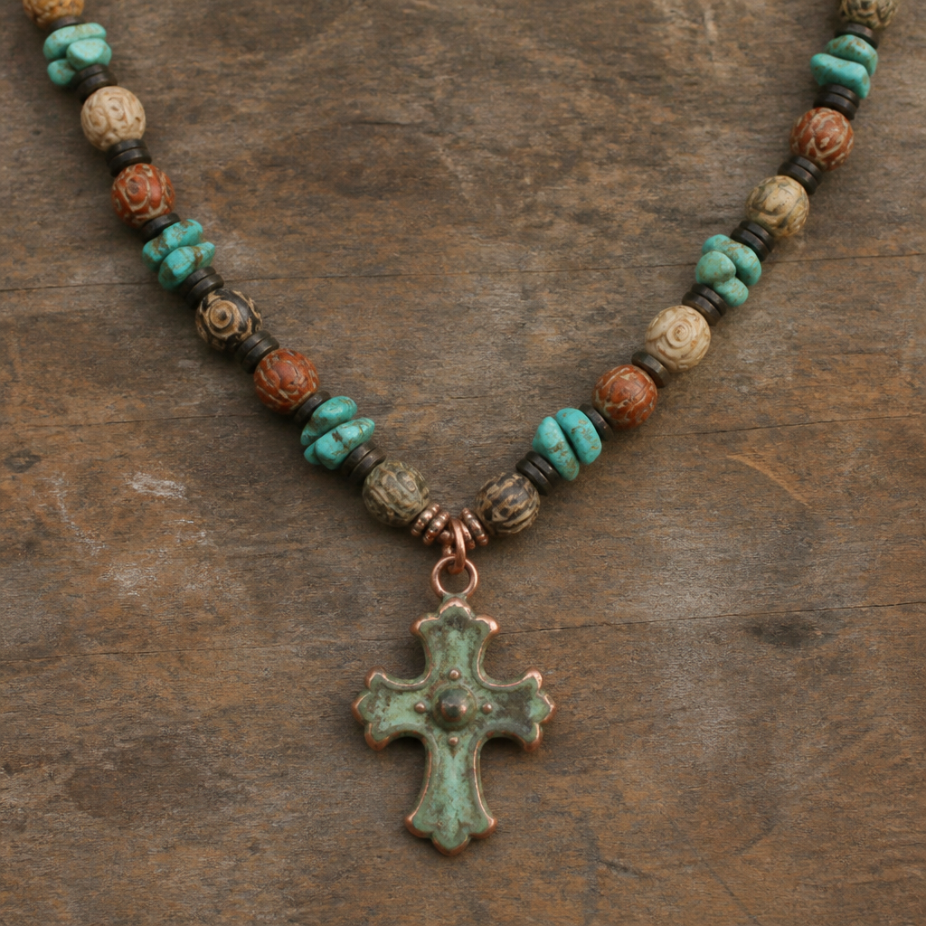 "8.5-9mm soapstone in earth tones with carved eye round beads, turquoise chunky chips 9x12mm, Heishi beads 3mm, copper with green patina cross pendant 3x4" necklace "
photorealistic jewelry design, "8.5-9mm soapstone in earth tones with carved eye round beads, turquoise chunky chips 9x12mm, Heishi beads 3mm, copper with green patina cross pendant 3x4" necklace ", vintage style, just the design no text