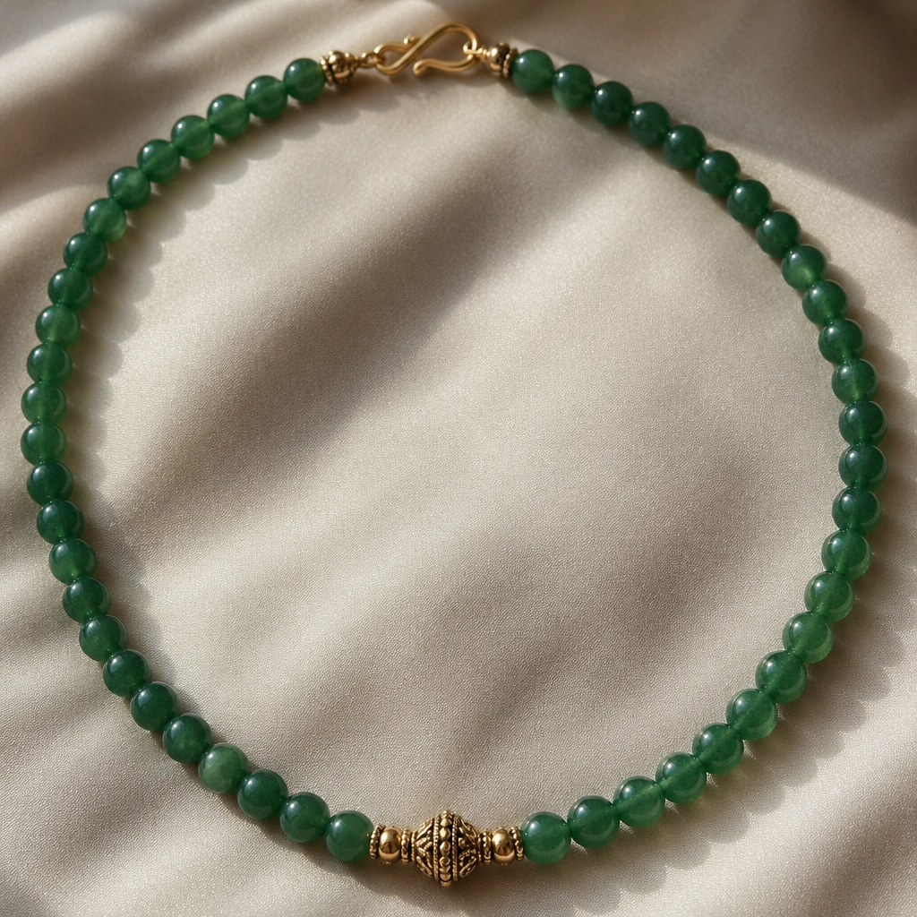 Create an aventurine beaded necklace with round beads. Use string and a gold clasp. Make it elegant.
photorealistic jewelry design, Create an aventurine beaded necklace with round beads. Use string and a gold clasp. Make it elegant., ethnic style, just the design no text