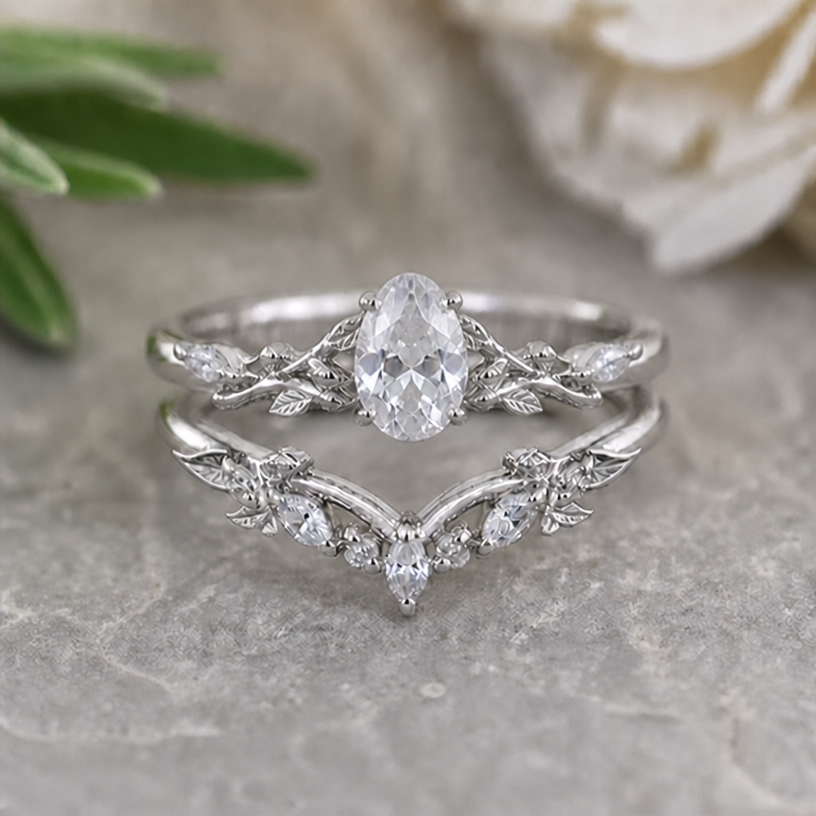 Replace the shape of the upper main stone with an oval crystal, keep all other details
edit the attached jewelry design with these instructions: Replace the shape of the upper main stone with an oval crystal, keep all other details. keep it photorealistic, just the design no text